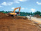 Décapage, à l'aide d'une pelle mécanique, des terres de surface sur le site de Katoury à Cayenne (Guyanne), 2002.