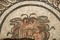 Détail du visage de Méduse représenté sur une mosaïque mise au jour dans un édifice daté du IIème siècle de notre ère lors des fouilles menées dans le collège Auguste et Louis Lumière de Besançon (Franche-Comté) en 2002-2003. 