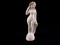 Vénus anadyomène (sortant de l'eau) en terre cuite blanche de l'Allier, vue de face, représentée nue, debout sur un piédestal, IIe-IIIe s. de notre ère, nécropole de Pont-l’Évêque, Autun (Saône-et-Loire), 2010.  Cet objet a été déposé au sein d'une inhumation d'enfant en cercueil. 