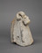 Fragment de chenet en forme de tête de bélier, terre cuite, 1er-IIIe siècle, découvert au n° 18 de la rue Porte Saint-Jean à Orléans (Loiret). Comme pour la période gauloise, les chenets en terre cuite sont souvent couronnés d'une tête de bélier. 