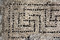 Détail de tesselles disposées en lignes et formant des motifs de svastikas provenant d'une des mosaïques antiques découvertes à Uzès (Gard), 2017.