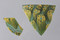 Fragments de coupe en pâte de verre dit  millefleuri  ou verre mosaïqué d'origine italienne, mis au jour dans la partie agricole pars rustica de la villa gallo-romaine à Vire (Calvados).