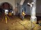 Décapage à la mini pelle électrique et test d'orthophotographie dans l'église Sainte-Benoite de Lerzy (Aisne). On distingue au sol la fondation de l'arc triomphal d'époque romane et un lambeau de sol en brique d'époque moderne.