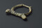 Boucle de ceinture en bronze, 13e-14e siècle, découverte lors de la fouille de la Zac Pasteur à Besançon (Doubs) entre 2010 et 2011. Boucle semi-circulaire dont il manque l'ardillon (partie pointue et articulée s'intégrant dans la courroie en cuir de la ceinture). 