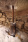 Vestiges du mécanisme d'entrainement d'un des moulins mis au jour à Saorge (Alpes-Maritimes): Le pal (axe métallique) fiché dans la bassègue (axe en bois) sous la meule dormante. 