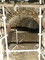 Départ d'une galerie souterraine sous le mur gouttereau sud de l'église du XIVe siècle de l'ancienne chartreuse de Sainte-Croix-en-Jaretz (Loire). La présence de cette galerie et la découverte de plusieurs cavités (façonnées ou maçonnées) suggère une gestion raisonnée de l'eau dans ce secteur de la chartreuse dès l'époque médiévale. 