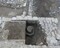 Vue de la fosse de coulée de cloches en cours de fouille à Baume-les-Dames (Doubs). Cette fosse a été aménagée dans le courant du 13e siècle, sur le tracé du mur occidental de l'église antérieure. Au sein de cette fosse, dont le comblement était riche en résidus d'alliage cuivreux, a été observée la base de deux noyaux de cloche en argile jaune, de 0,51 et 0,80 m de diamètre. 