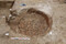 Détail de la sole d'un four de potier composée de tessons d'amphore (fin du Ier s.-IIe siècle) mis au jour en périphérie de la ferme romaine à Méaulte (Somme). 