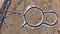 Vue aérienne du triple enclos du Néolithique à Marliens (Côte d'Or). Au centre du monument se trouvait un enclos circulaire de 11 m de diamètre. A droite un enclos en forme de fer à cheval de 8 m de long et à gauche un enclos ouvert qui s'adosse à l'enclos central. La présence d'une couche de graviers, observée dans le comblement de des deux enclos latéraux, atteste de l'existence d'une palissade. Ce type de monument semble inédit. 