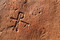 Détail d'un chrisme gravé sur une tuile utilisée dans le coffrage d'une tombe paléochrétienne à Propriano (Corse-du-Sud), 2009.  Au cours de cette fouille, un édifice antique, un ensemble d'églises et une nécropole ont été également dégagés. 