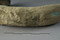 Détail d'un décor conservé sur un des sept bracelets en bronze découverts dans un vase en terre cuite à l'occasion d'un diagnostic mené à Domloup (Ille-et-Vilaine) en 2009. Par leurs caractéristiques, ils peuvent être datés des environs de 1300 avant notre ère.  