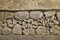 Vue de détail des fondations antiques d'une caserne de soldats de la classis britannica, IIe s. de notre ère dans la salle du transept nord de la crypte de la basilique Notre-Dame de Boulogne-sur-Mer (Pas-de-Calais), 2012.