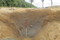Coupe stratigraphique réalisée dans un fossé de la ferme gauloise de Saint-Sauveur-des-Landes (Ille-et-Vilaine), 2012.La moitié inférieure de la coupe, très argileuse, rend compte de la stagnation d'eau. 