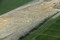 Vue aérienne du site de la Claraiserie en cours de fouille, Ossé (Ille-et-Vilaine), 2013.Une partie d'une ferme gauloise et plusieurs parcelles agricoles associées à l'établissement ont été mis au jour sur 37 000 m2.
