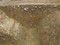 Coupe réalisée dans le premier fossé entourant le sanctuaire au Ier s. de notre ère, La Grillère, Saint-Denis-du-Maine (Mayenne), 2012.Cette enceinte fossoyée, taillée dans le schiste, forme un carré de 54 m de côté.