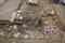 Cheminée bâtie avec des fragments de tuiles et différentes pierres en remploi, aménagée dans l'angle d'une pièce d'une maison romaine, esplanade de la Major, Marseille, 2008.  Photo publiée dans l'ouvrage Quand les archéologues redécouvrent Marseille, M. Bouiron, P. Mellinand.