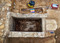 Vue zénithale d'un caveau funéraire du XIXe s. dont la dalle d'ouverture a sans doute été renversée et brisée lors de son curage en 1905, ancien cimetière des Petites-Crottes, Marseille, 2013.La mise au jour de ce type de sépultures architecturées illustre l'apparition au XIXe s. des classes sociales dans le cimetière communautaire.     