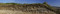 Coupe stratigraphique sur le site du Mont Castel à Port-en-Bessin (Calvados), 2014.  De bas en haut : couche noire, âge du Bronze final ; couche blanche, La Tène ancienne ; couche brune, rempart romain. 